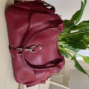 Brick red over the shoulder Cole Han bag. Zippers all work. Good condition.